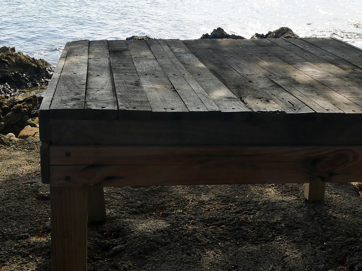 A weathered wooden table on the shore at Savaneta, Aruba